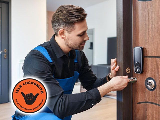 locksmith technician installing smart lock on door