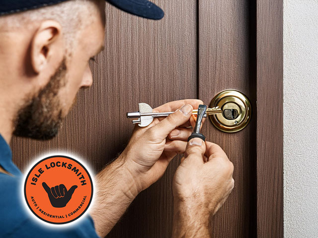 technician locksmith professional removing broken key from lock in door